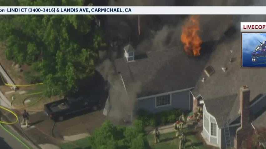 Firefighters tackle house fire in Carmichael