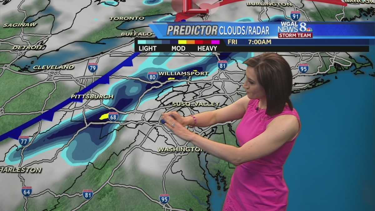 Breezy and cooler with isolated showers today