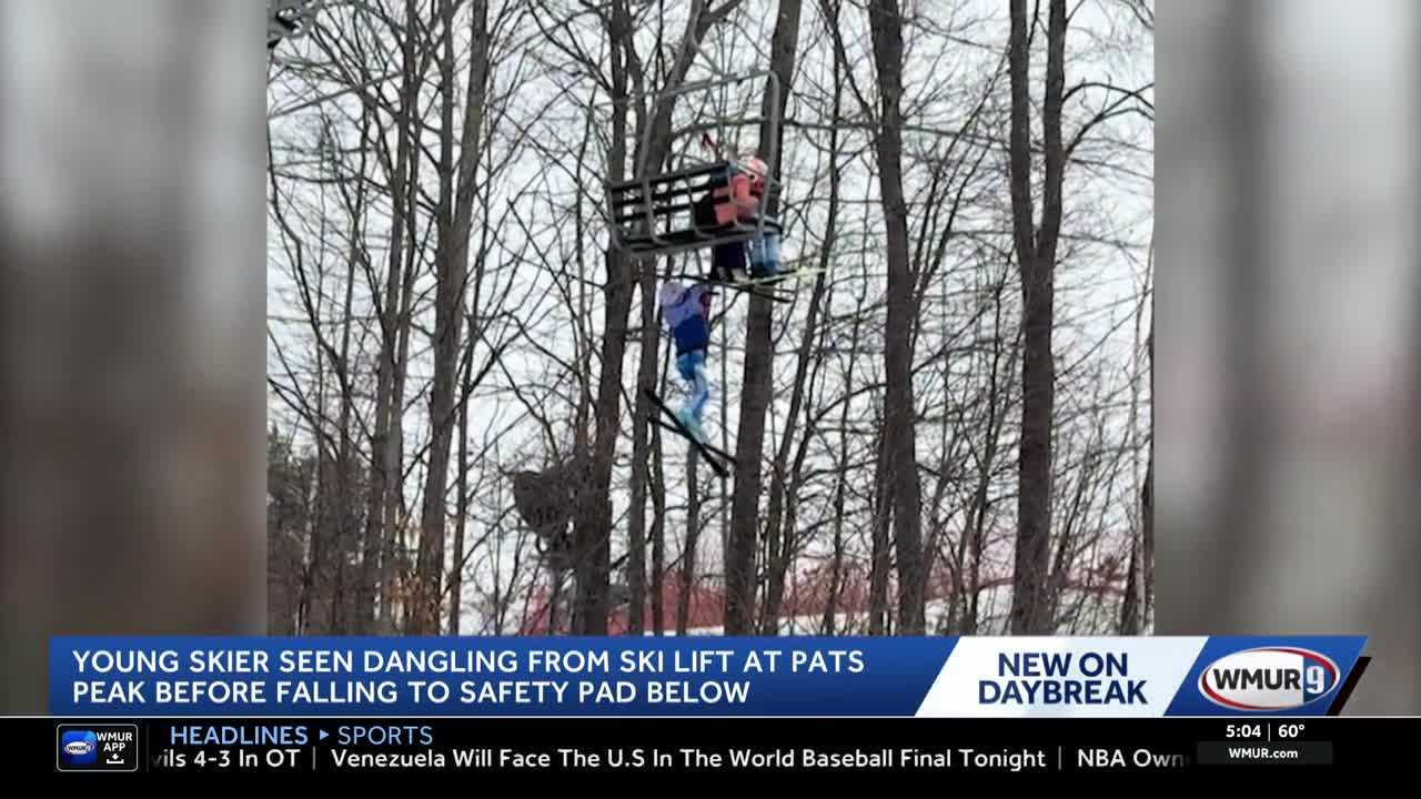 Video captures young skier dangling, falling from ski lift