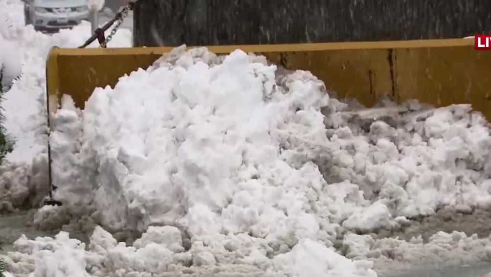 Snow piles up in Derry, New Hampshire as crews clear roads