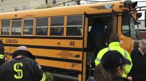 Vehicle collides with school bus with kids on board