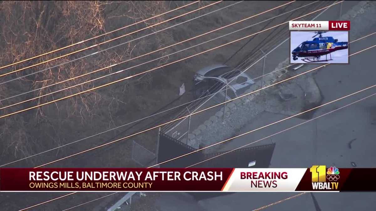 Driver rescued after car crashes through fence in Owings Mills