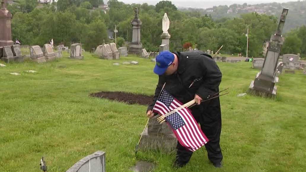 'They need to be memorialized': Volunteers place flags on local veterans' graves