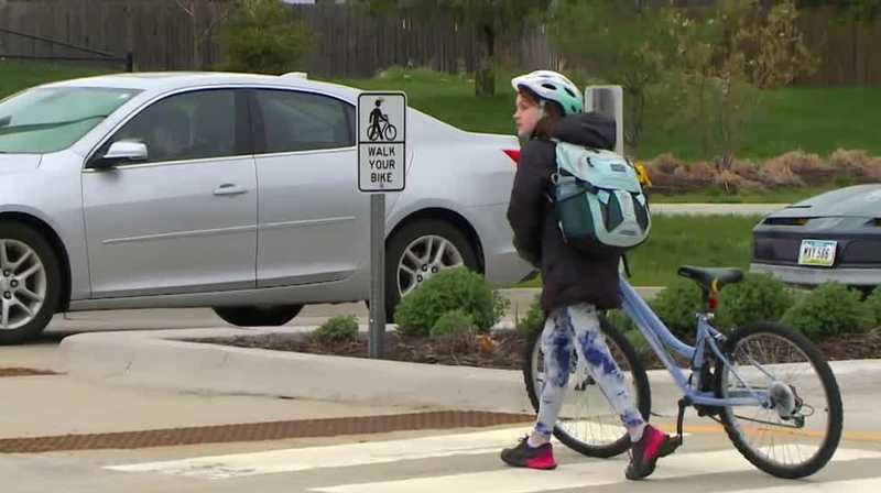 Cyclists reminded to walk their bike across intersections in Waukee