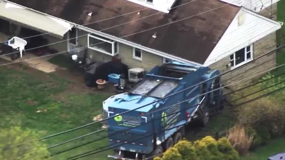 Garbage truck hits house on W. Sutter Road
