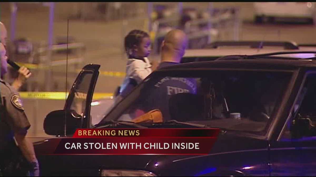 Men steal car with child inside
