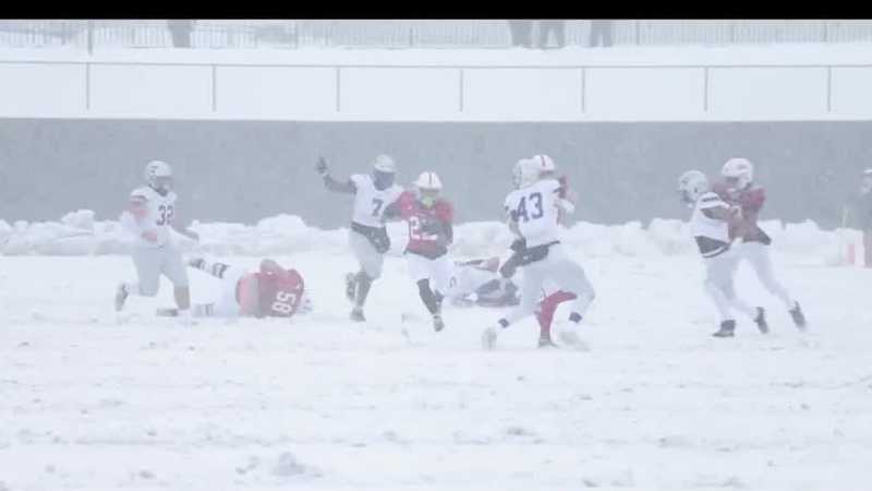 College football teams in Iowa host playoff games during snowstorm