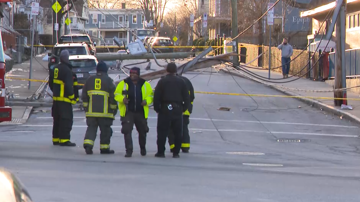 High winds bring down utility poles, power outage on a Dorchester street