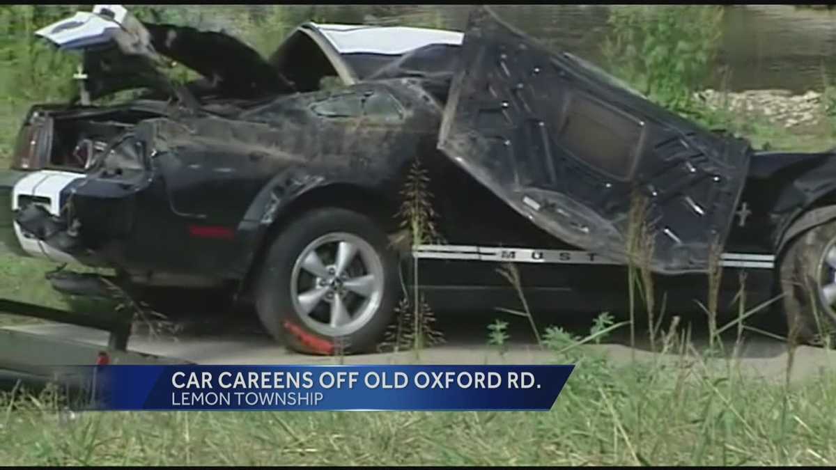 Car ends up on riverbank after crash
