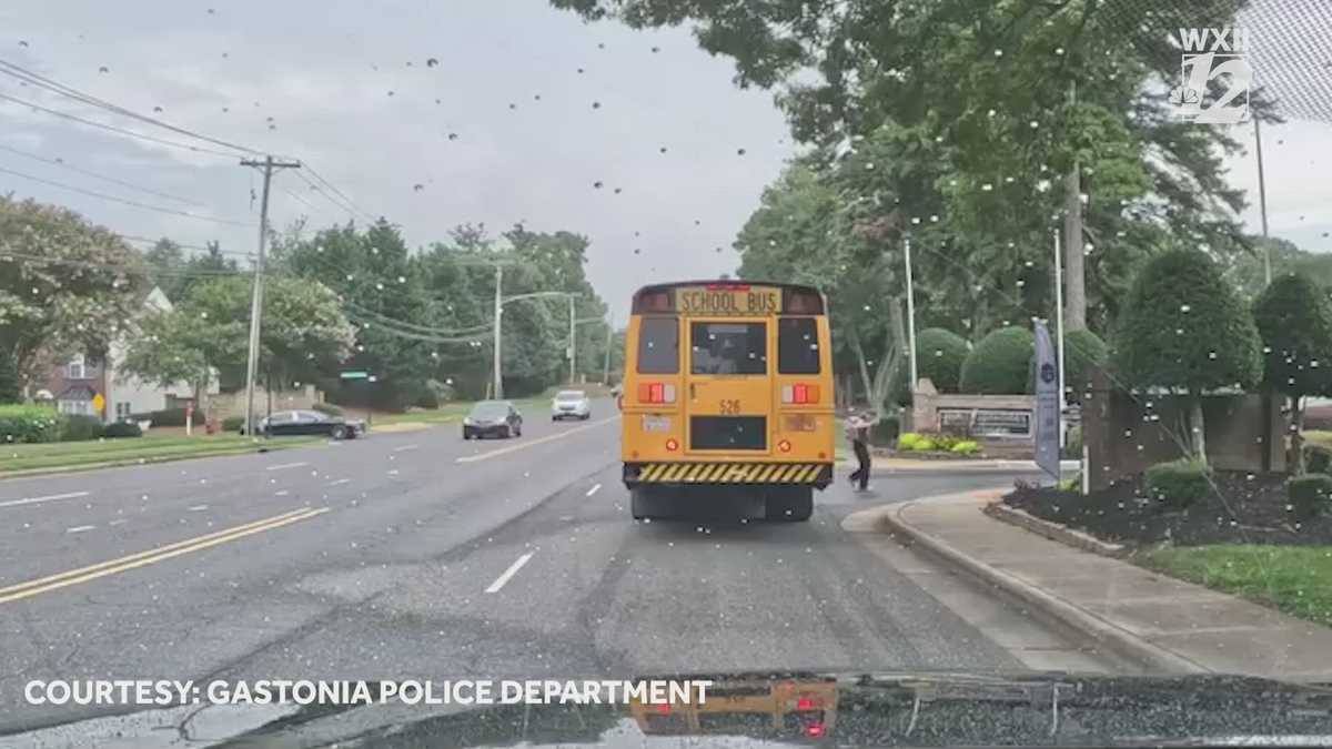 Caught on camera as driver speeds by stopped school bus and police officer in North Carolina