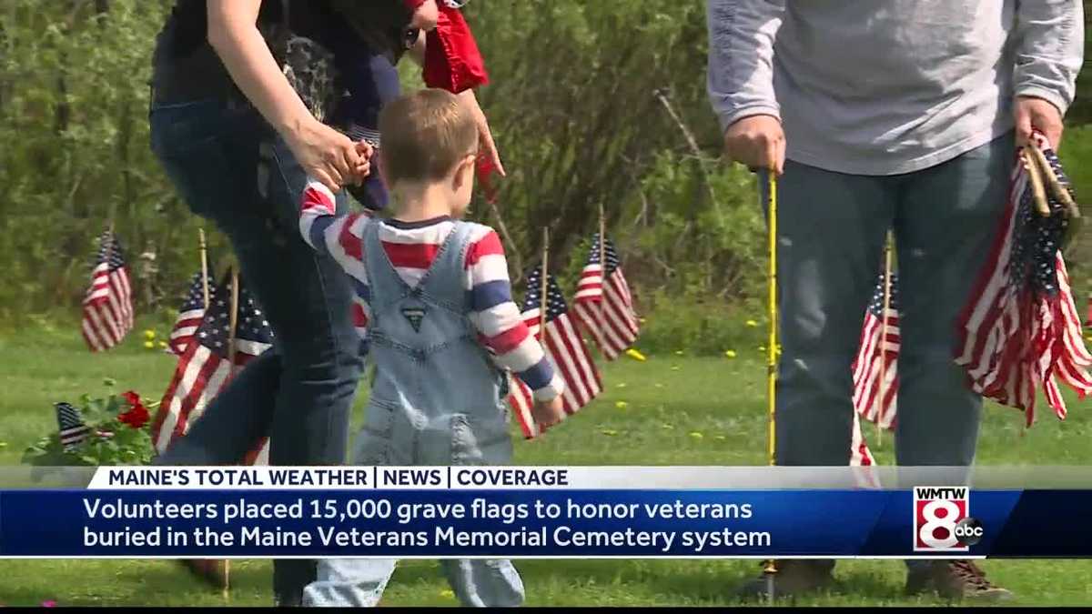 Dozens of volunteers lay flags at veterans cemetery for Memorial Day ...