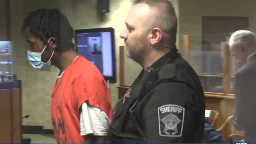 Man accused of shooting at officers inside police station accepts plea deal