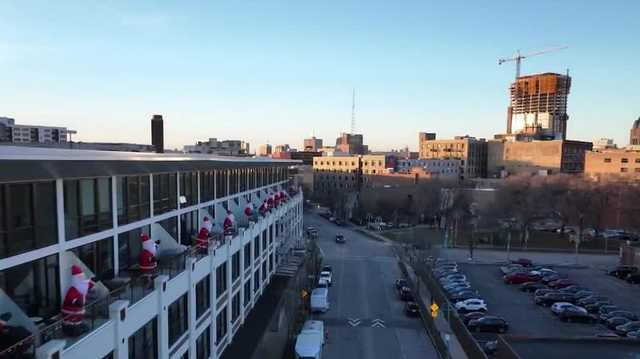 Santas bring holiday cheer atop balconies in Milwaukee's Third Ward - Vimarsana News