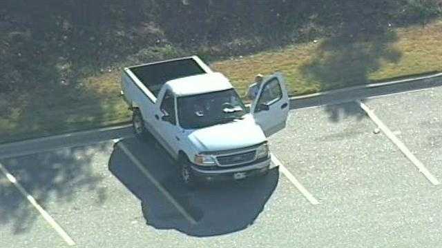 Police: Armed man causes standoff in Walmart parking lot