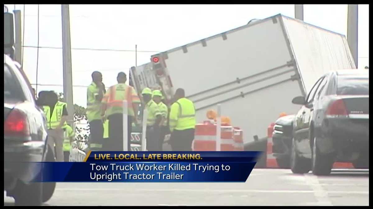 Tow truck worker killed trying to upright tractor trailer