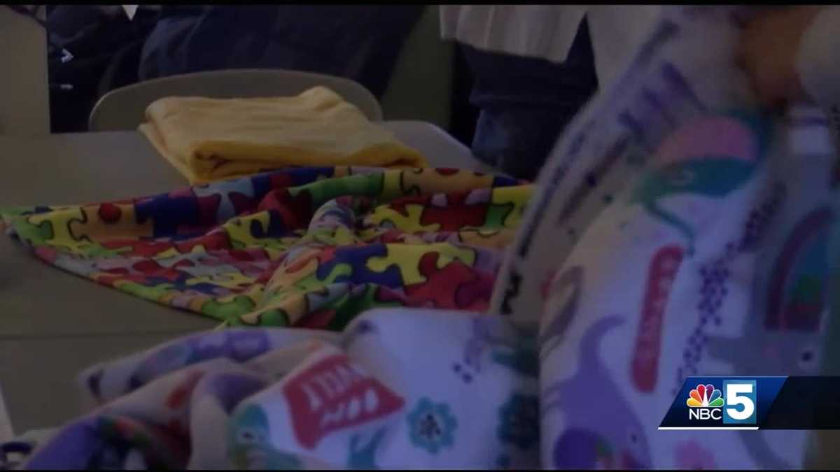 Students make blankets for children's hospital patients