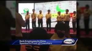Raw video: Bankers spanked with paddle for poor performance