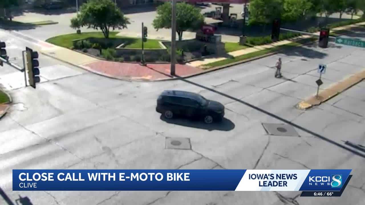Police release video of person on e-scooter running red light before being hit by a car in Iowa