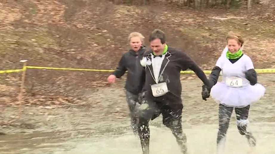 Couple gets married at Maine mud run