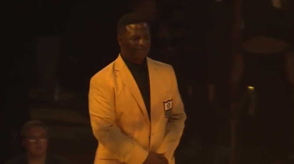 Come get your jacket, LeRoy. Leroy Butler finally puts on his