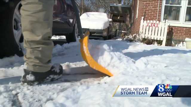 Volunteers help others shovel out after snow - Vimarsana News