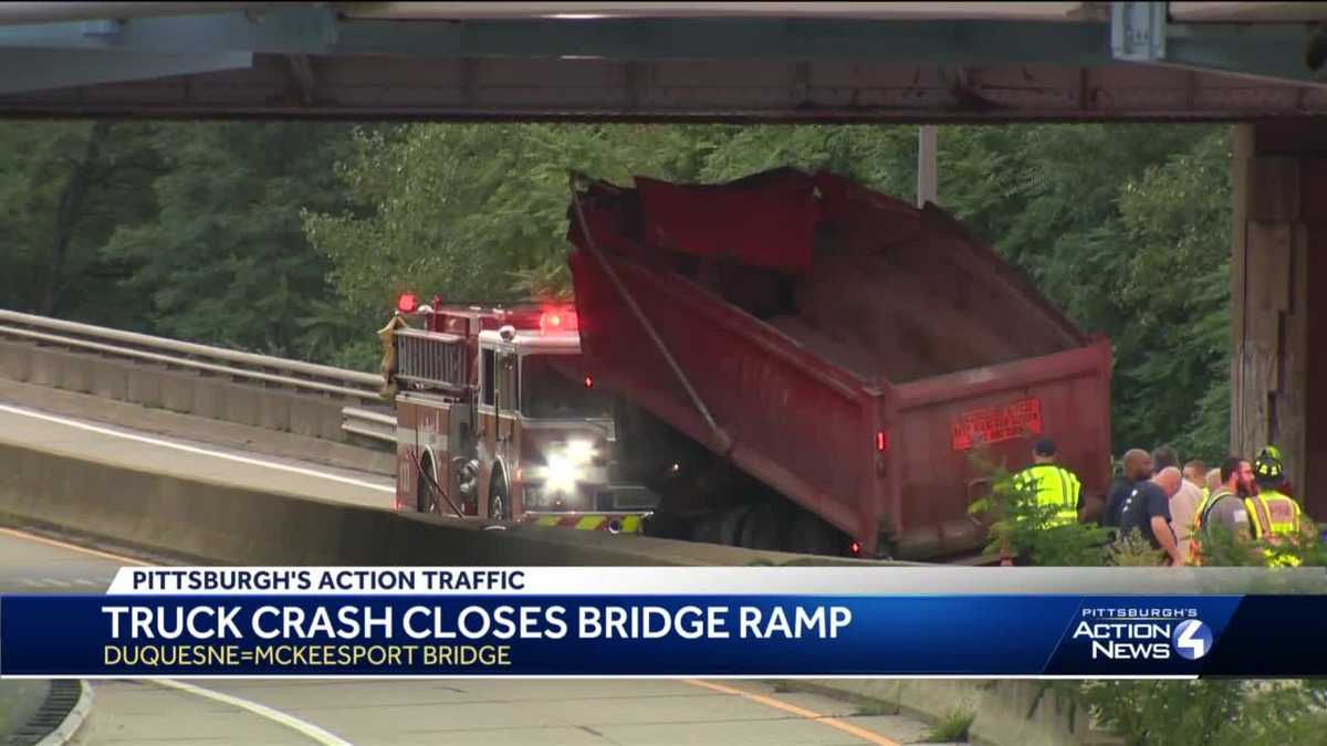 Restrictions in place after truck hits beam on bridge that spans ...