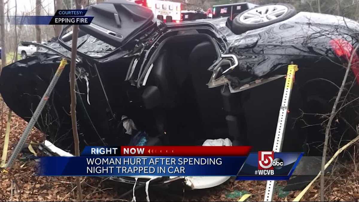 Woman hurt after spending night trapped in car