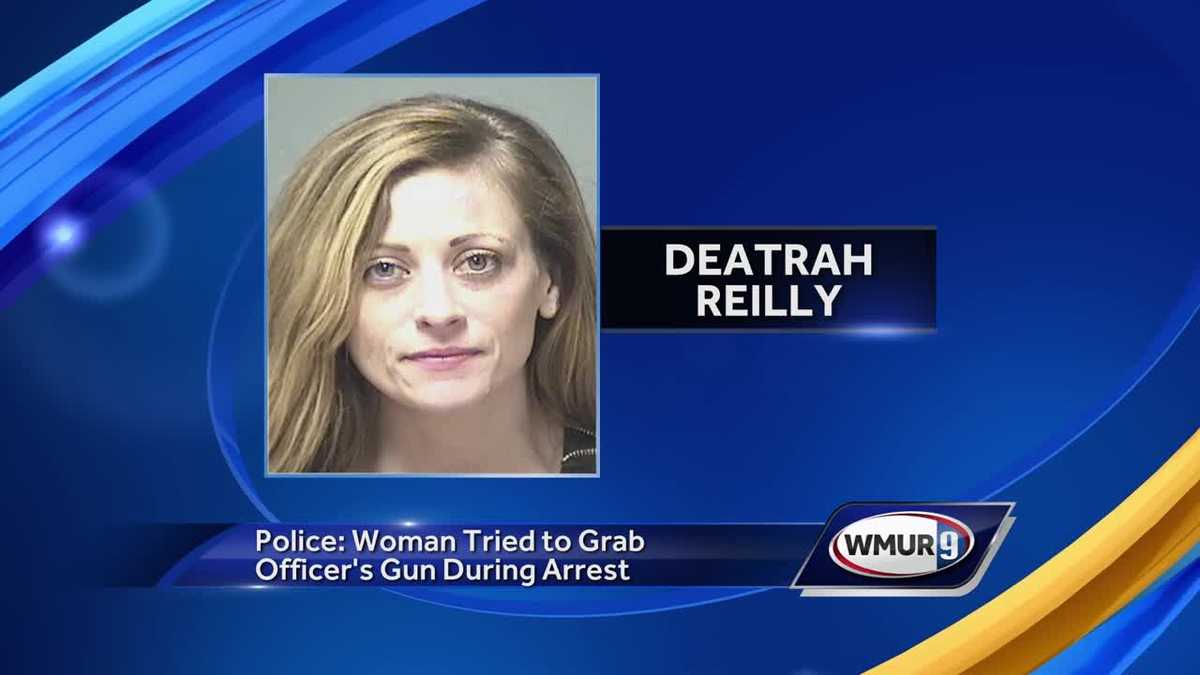 Police: Woman tried to grab officer's gun during arrest