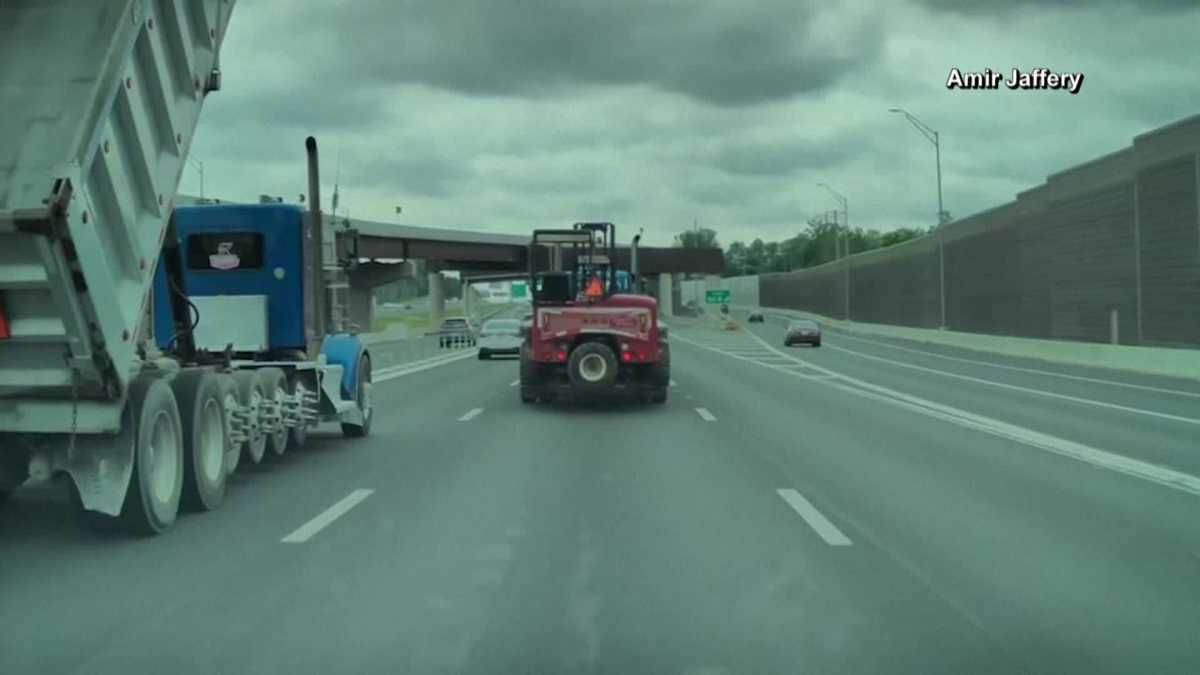 Dump truck with raised bed slams into bridge in Virginia