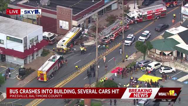 LIVE REPORT: MTA bus crashes into cars, building in Pikesville