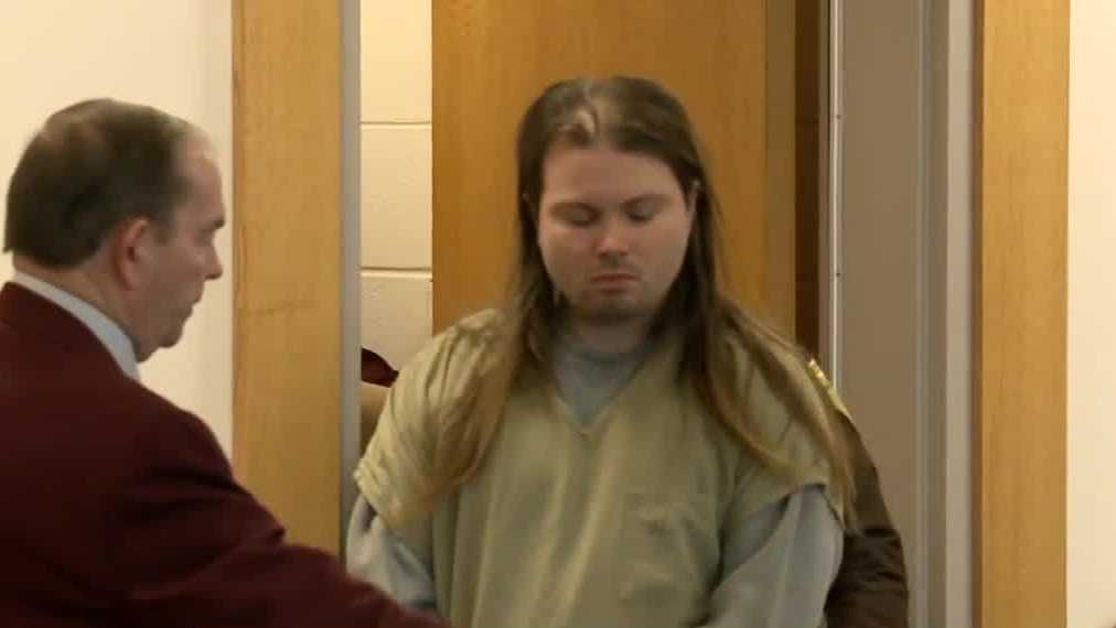 Man charged in shootings of 2 Manchester officers recommitted
