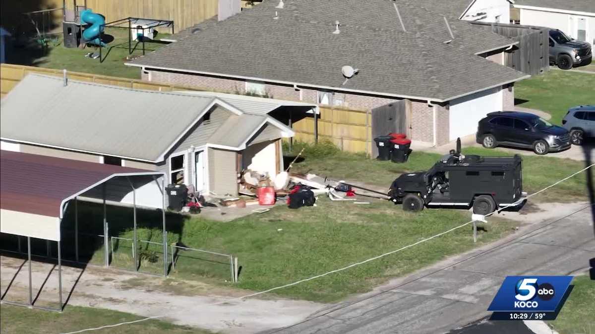 Son accused of holding gun to mother’s stomach arrested after 6-hour standoff in Jones