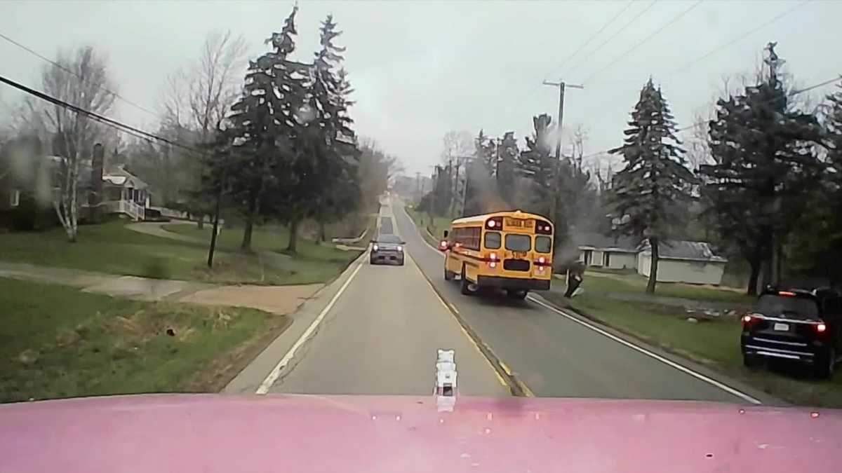 Out of control tractor-trailer nearly crashes into stopped school bus