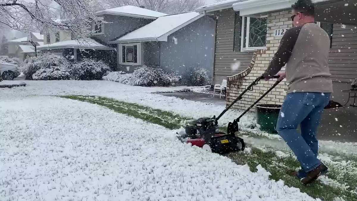 'Another beautiful spring day in Nebraska!' Man mows lawn as snow comes down in viral video