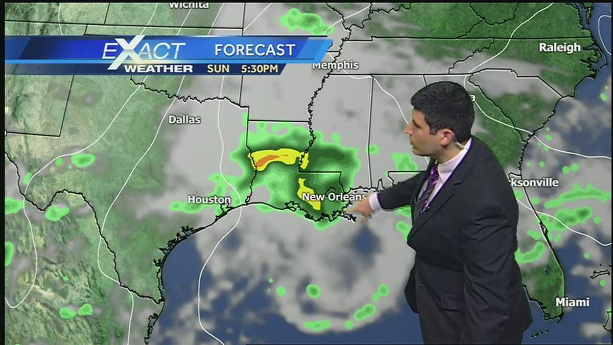 Partly cloudy, warm, with isolated showers by late afternoon