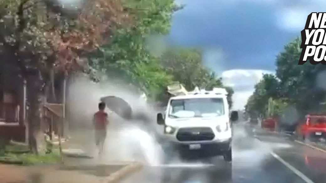 Driver fired after being filmed purposely splashing pedestrians