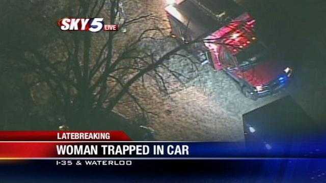Woman trapped in car after wreck along I-35