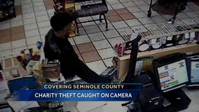 Man caught on camera stealing from charity