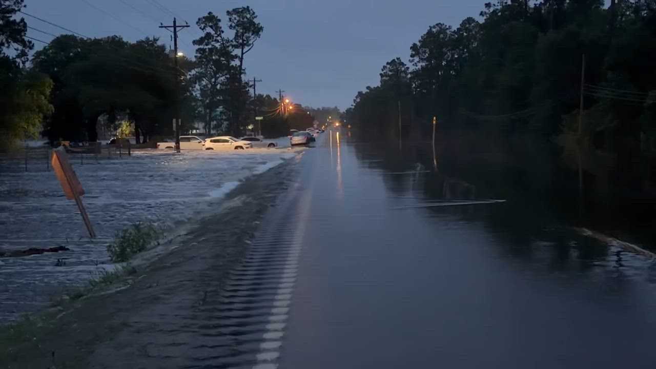 New video shows floodwater rushing over roads in Kiln, Mississippi
