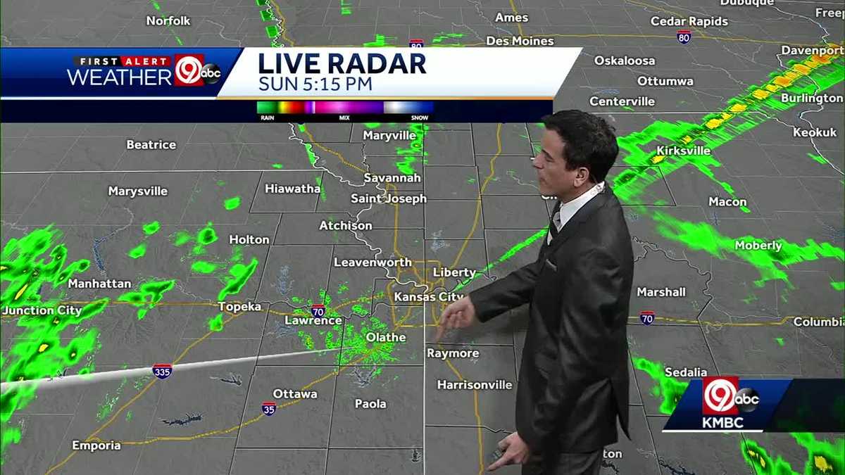 Breezy overnight, spotty showers possible into Monday morning