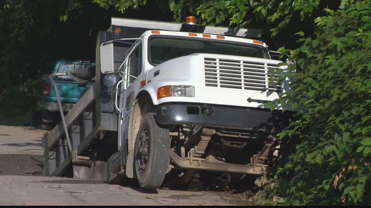 Truck stuck in hole from Carrick water main break