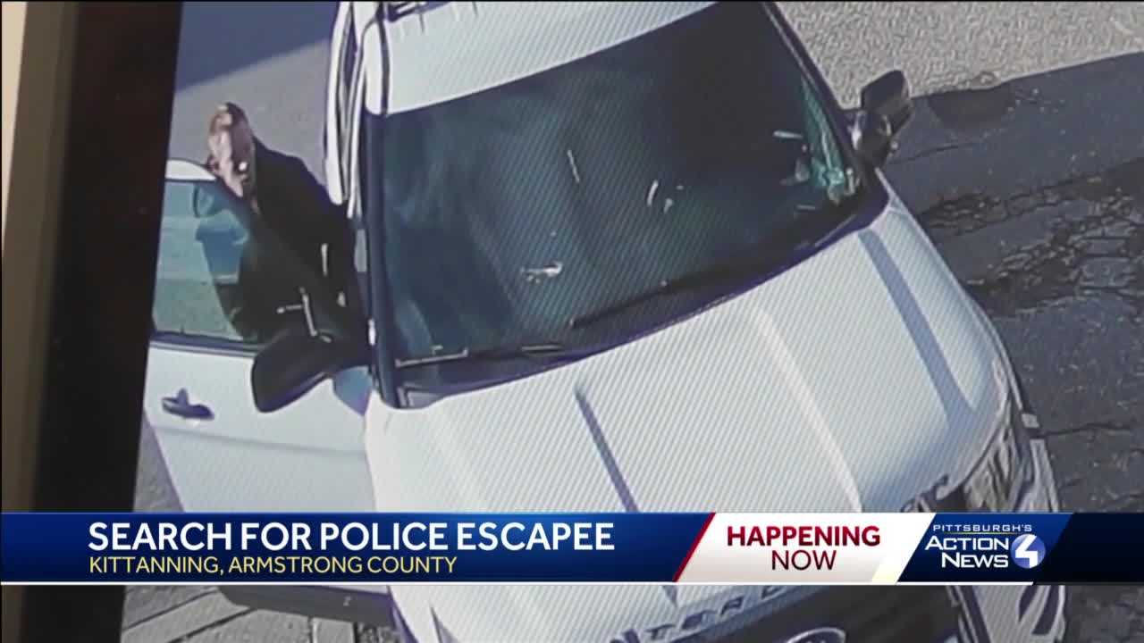 Surveillance Video Captures Suspect Escaping From Police Cruiser In ...