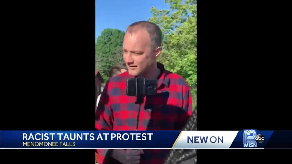 Woman says man shouted racial slurs at protesters