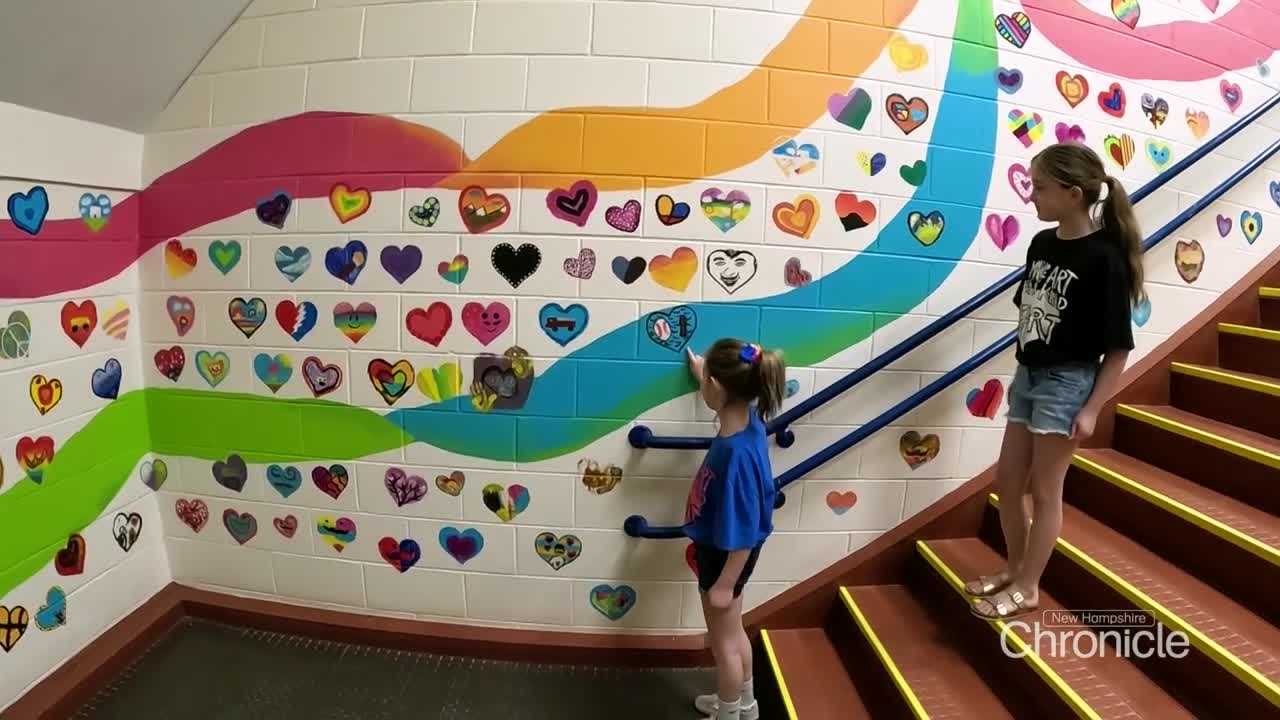Painted hearts line halls at Hampstead school in honor of beloved art teacher who died last year
