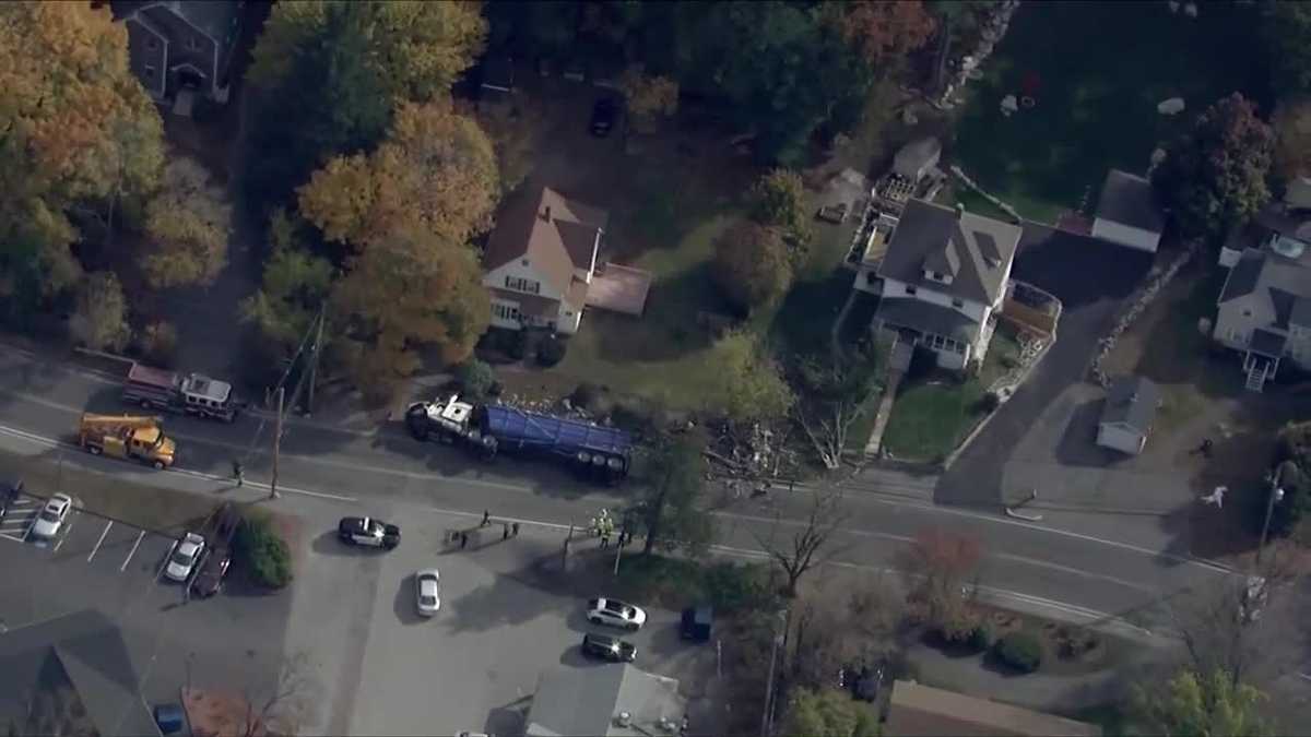 Truck rollover takes out utility pole, spills debris on front lawn