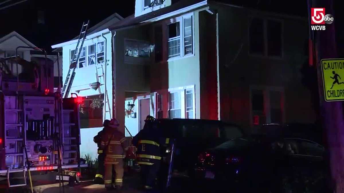 Woman rescued from roof of burning building thanks firefighters