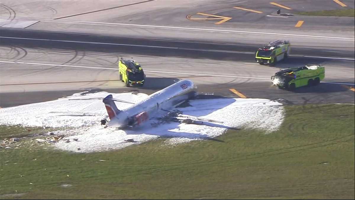 Official: Plane catches fire at Miami airport, 3 injuries