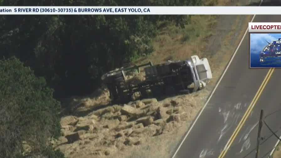 Truck carrying hay crashes, overturns in Yolo County