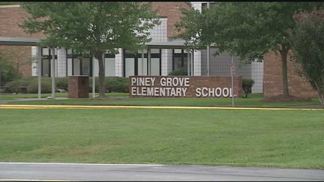Child spanked by parent on school grounds