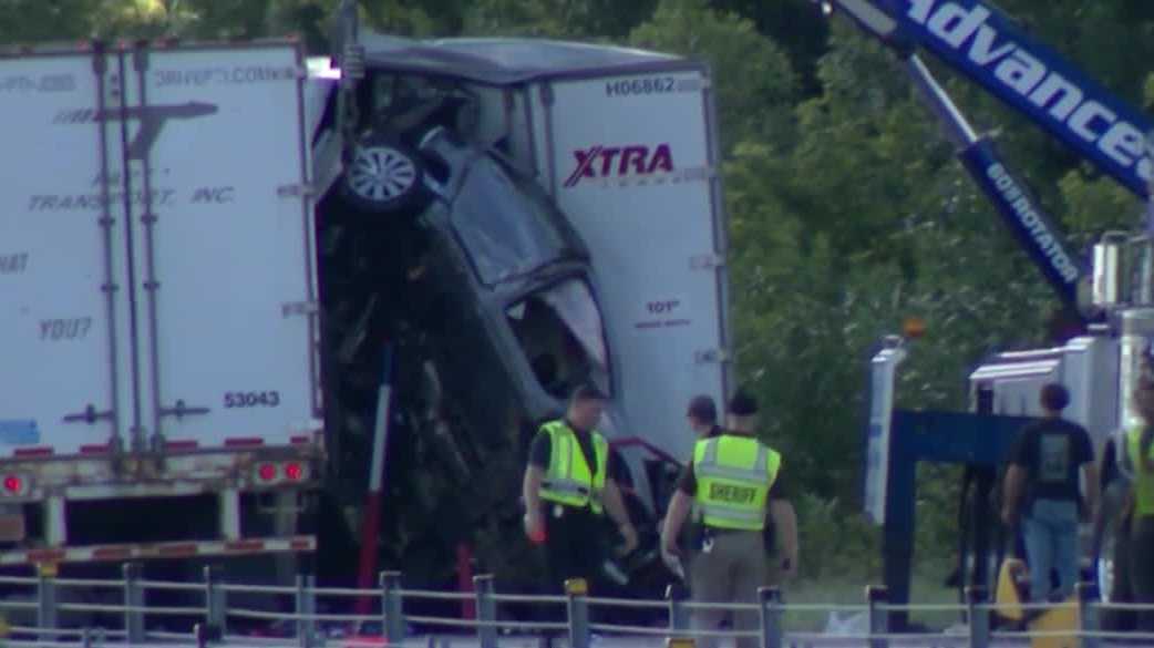 'It was a miracle': Family survives 6-vehicle pileup, trapped inside car stuck between semis